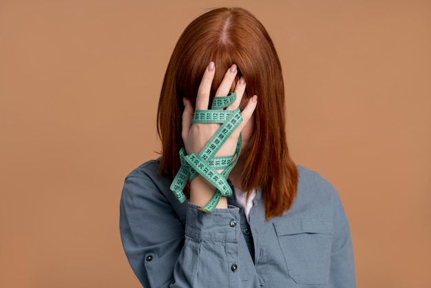 Woman with measuring tape-Bridge Health (OCD)