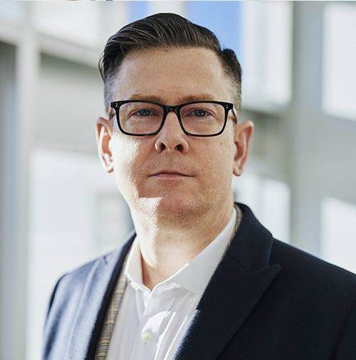 Man in glasses and suit (James L Client)-Bridge Health